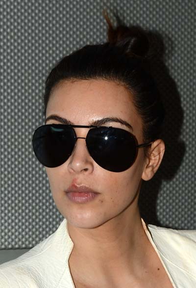 Kim Kardashian Returns From The Middle East Make-Up Free With Cold Sores