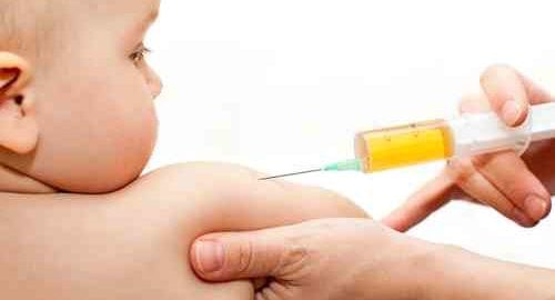 Infant receiving a vaccination injection.